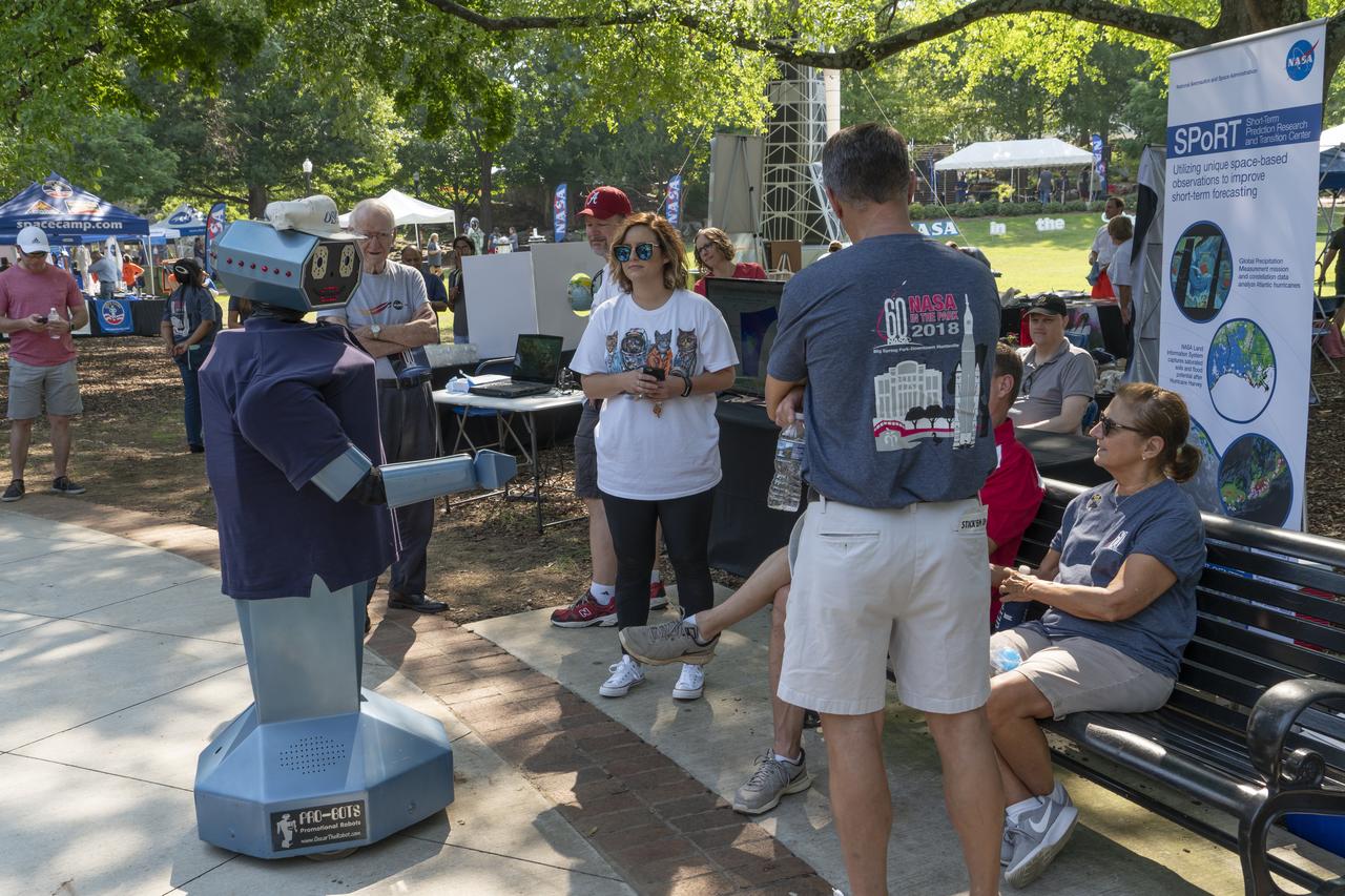  NASA's Marshall Space Flight Center showcased it's various projects for the public in Huntsville, Alabama's Big Spring Park. Exhibits were displayed by all of the various directorates of the Center with employee volunteers explaining all aspects of their projects. Adding to the festivities was the attendance of retired NASA astronaut Robert "Hoot" Gibson. Oscar the Robot greets volunteers at NASA Day in the Park.