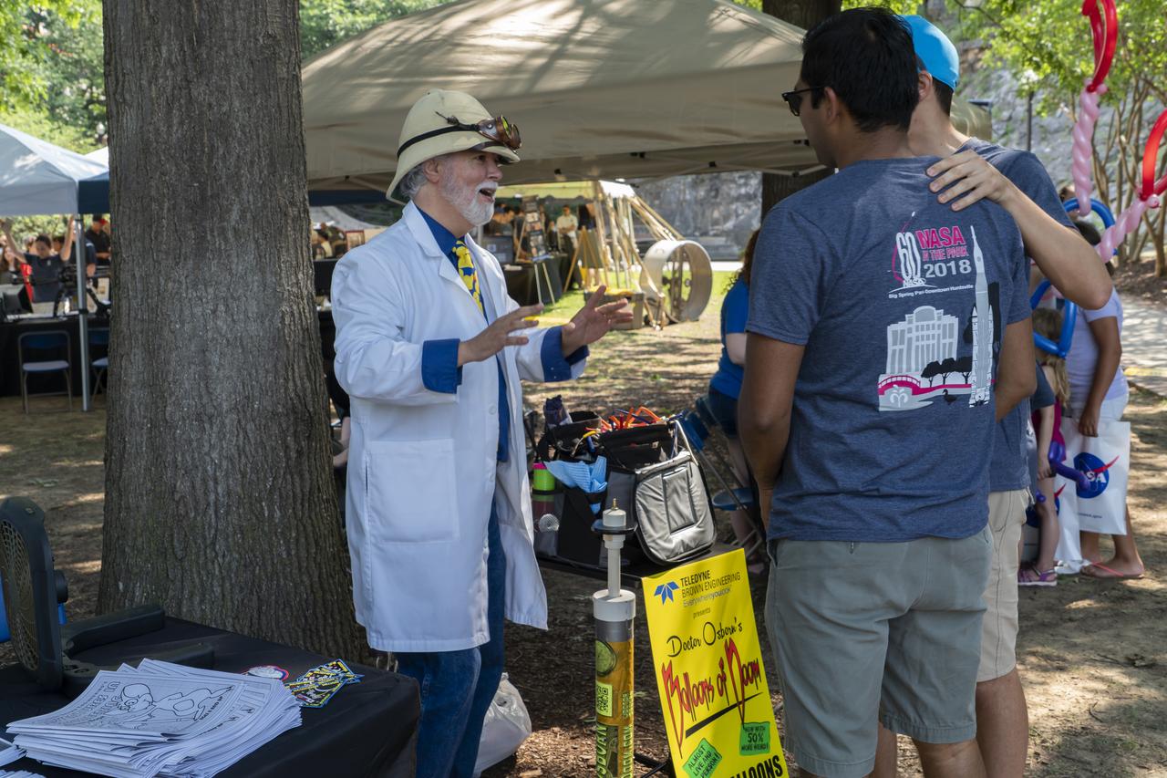 NASA's Marshall Space Flight Center showcased it's various projects for the public in Huntsville, Alabama's Big Spring Park. Exhibits were displayed by all of the various directorates of the Center with employee volunteers explaining all aspects of their projects. Adding to the festivities was the attendance of retired NASA astronaut Robert "Hoot" Gibson. Dr. Osborn, magician and balloon wizard, greets volunteers for NASA in the Park.