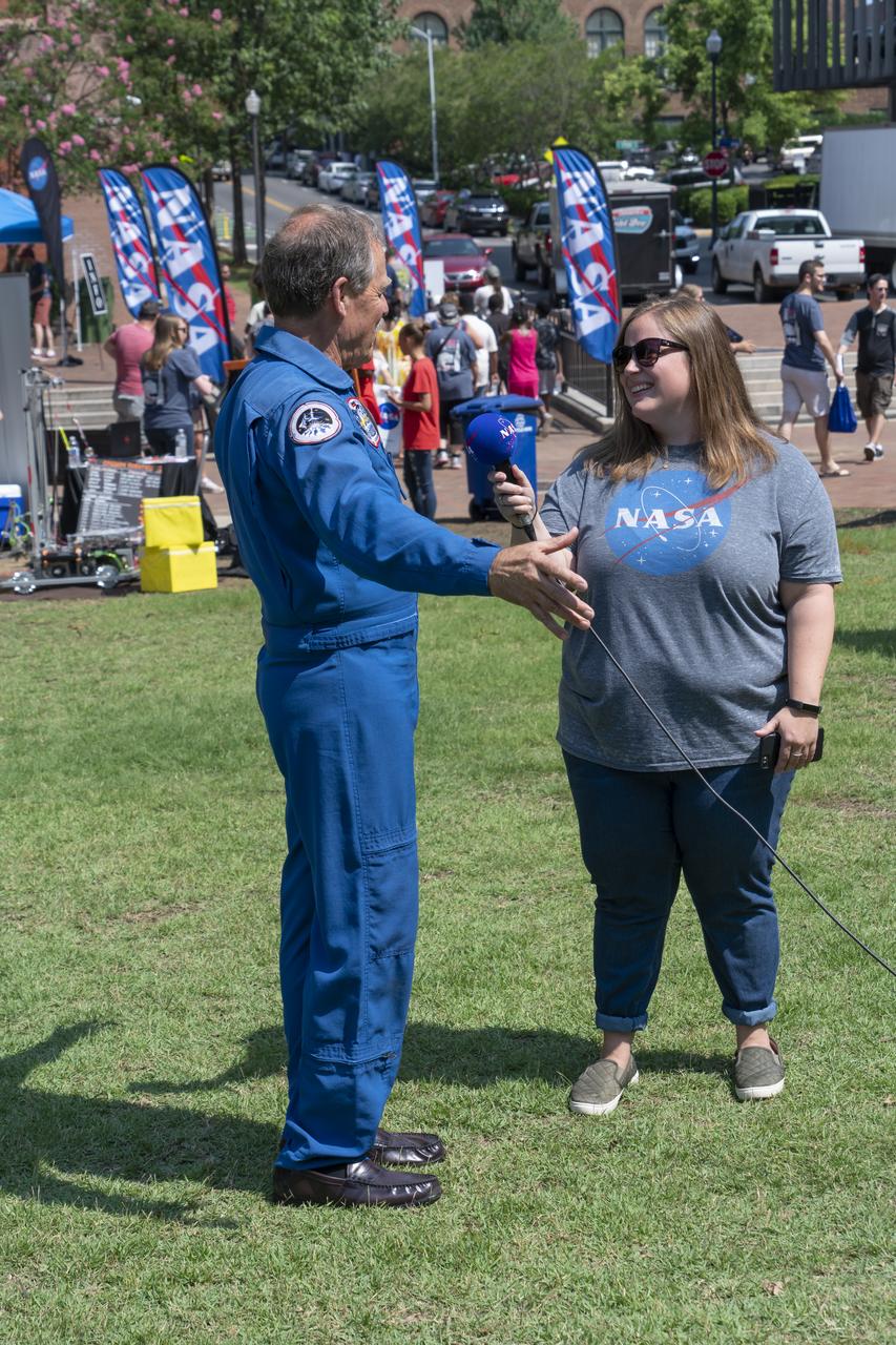 NASA's Marshall Space Flight Center showcased it's various projects for the public in Huntsville, Alabama's Big Spring Park. Exhibits were displayed by all of the various directorates of the Center with employee volunteers explaining all aspects of their projects. Adding to the festivities was the attendance of retired NASA astronaut Robert "Hoot" Gibson. NASA Public Affairs employee Jena Row interviews retired NASA Astronaut Robert â€œHootâ€ Gibson at NASA Day in the Park.