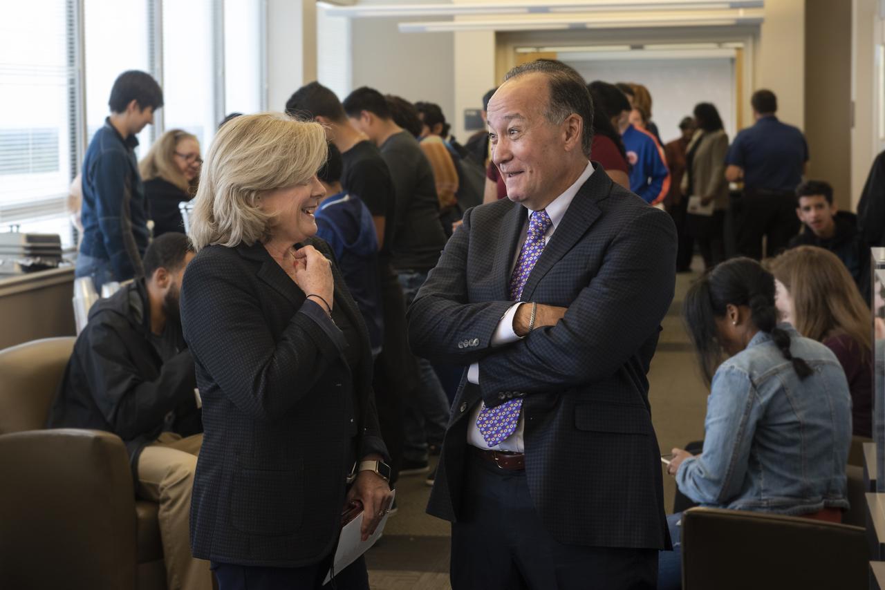 Ray Lugo, director of the Florida Space Institute in Orlando and former director of NASA's Glenn Research Center, talks with Jody Singer, director of NASA's Marshall Space Flight Center, Oct. 18 following his keynote address at Marshall's annual Hispanic Heritage Month celebration.