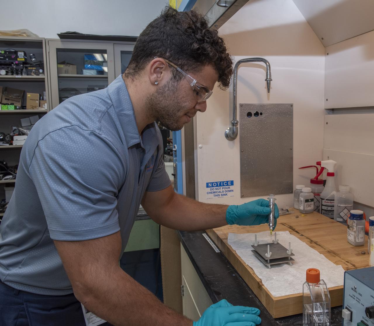 Allan Bonet (undergraduate student, University of Florida) prepares a test cell for ground-based testing in support of Dr. Ranga Narayananâ€™s (University of Florida) NASA grant â€œA Novel Way to Measure Interfacial Tension Using the Electrostatic Levitation Furnace (ELF)â€ (NNX17AL27G).    