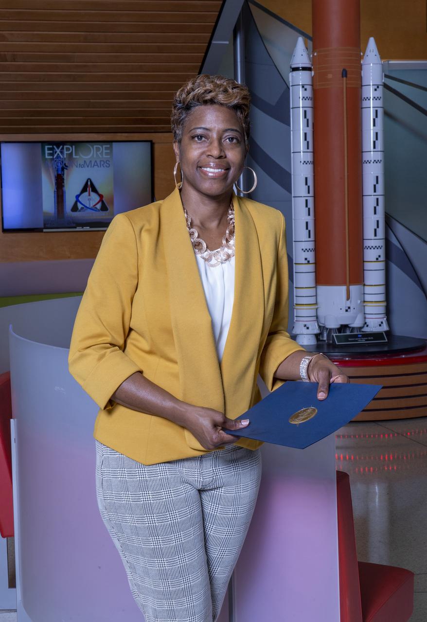  Dr. Ruth Jones, Branch Chief for Industrial Safety Branch (QD12) at MSFC, poses with model of Space Launch System, in Building 4220.  Photo for publication in University of Arkansas, Pine Bluff, Alumni magazine.