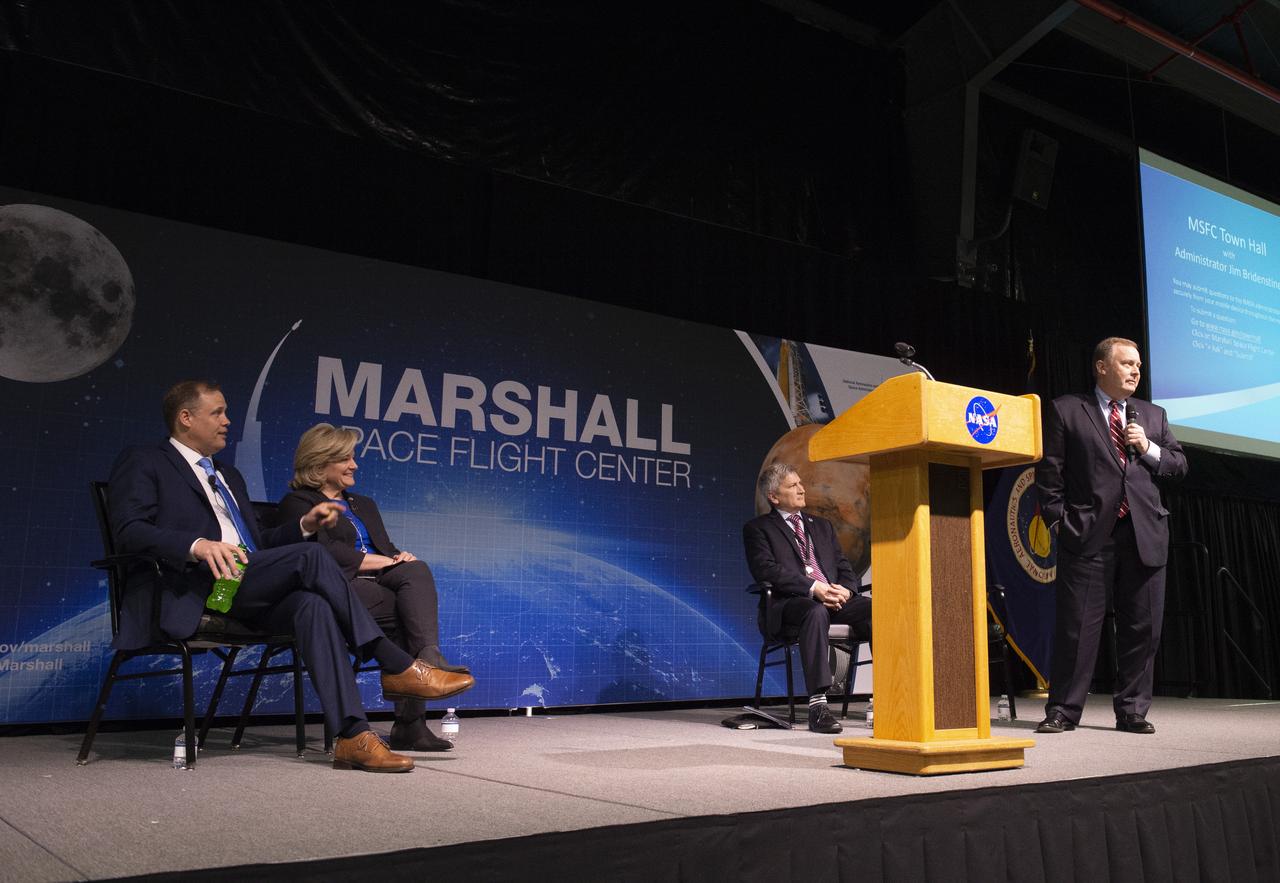 NASA Administrator Jim Bridenstine addresses Marshall team members during his March 26 all-hands event. Joining him on stage in Activities Building 4316 were Marshall Director Jody Singer, left, and Johnny Stephenson, right, director of the Office of Strategic Analysis & Communications with James Morhard, NASA deputy administrator.