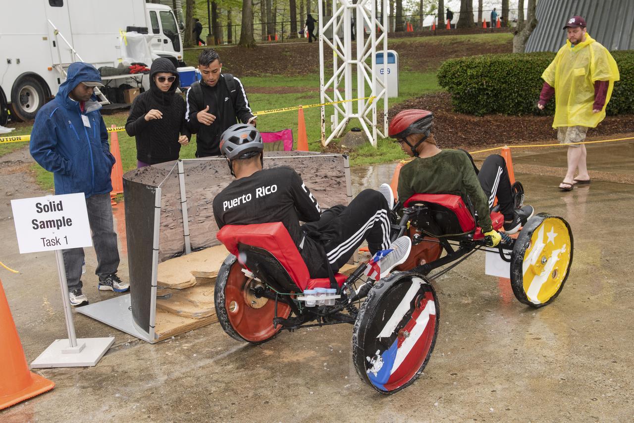 The 2019 Lunar Rover Challenge Competition was hosted by the U.S. Space and Rocket Center in Huntsville, Alabama. This annual event celebrated the 25th anniversary of what began as the Great Moonbuggy Race in 1994. High school and College teams from the United States and foreign countries competed. The awards ceremony was held at the adjacent Marriott on Saturday evening.