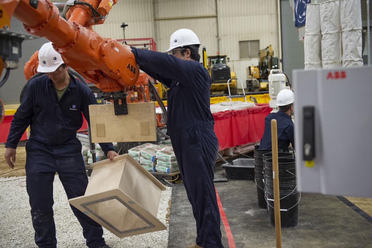 Team Penn State prepares their 3D-printer to begin printing a subscale habitat structure at NASA's 3D-Printed Habitat Challenge, held at the Caterpillar Edwards Demonstration & Learning Center in Edwards, Illinois, May 1-4, 2019. The habitat print is the final level of the multi-phase competition, which began in in 2015. The 3D-Printed Habitat Challenge is a competition to create sustainable shelters suitable for the Moon, Mars or beyond using resources available on-site in these locations. The challenge is managed by NASA's Centennial Challenges program, and partner Bradley University of Peoria, Illinois. 