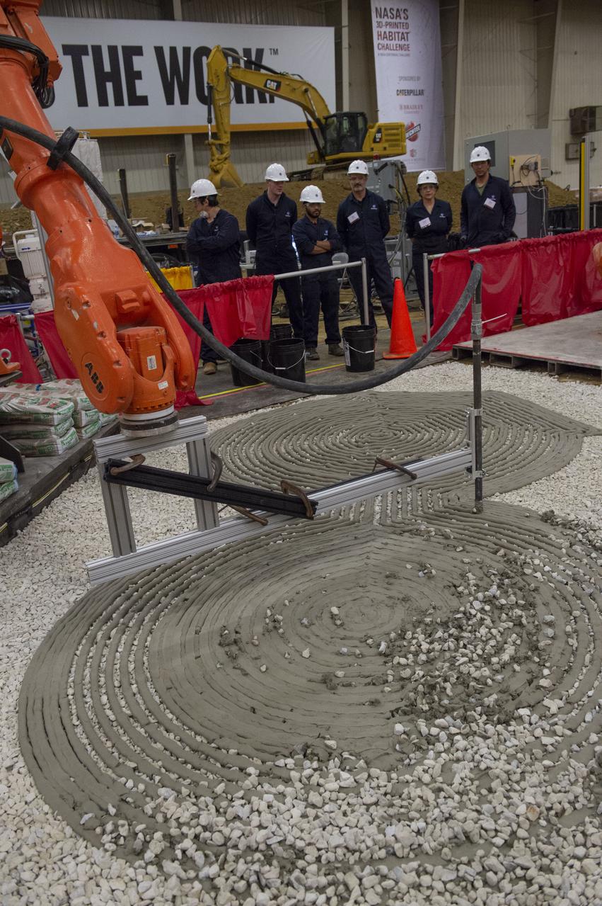 Team Penn State prepares their 3D-printer to begin printing a subscale habitat structure at NASA's 3D-Printed Habitat Challenge, held at the Caterpillar Edwards Demonstration & Learning Center in Edwards, Illinois, May 1-4, 2019. The habitat print is the final level of the multi-phase competition, which began in in 2015. The 3D-Printed Habitat Challenge is a competition to create sustainable shelters suitable for the Moon, Mars or beyond using resources available on-site in these locations. The challenge is managed by NASA's Centennial Challenges program, and partner Bradley University of Peoria, Illinois. 