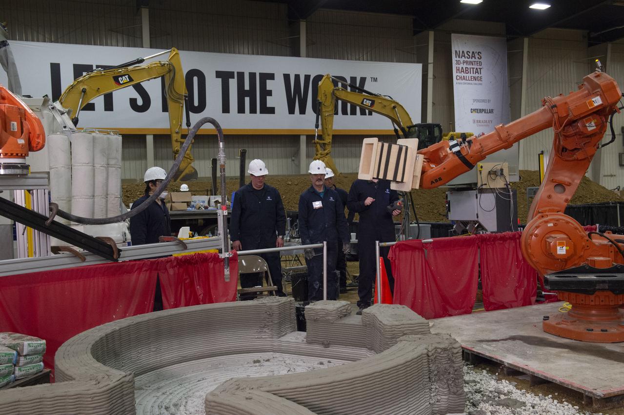 Team Penn State prepares their 3D-printer to begin printing a subscale habitat structure at NASA's 3D-Printed Habitat Challenge, held at the Caterpillar Edwards Demonstration & Learning Center in Edwards, Illinois, May 1-4, 2019. The habitat print is the final level of the multi-phase competition, which began in in 2015. The 3D-Printed Habitat Challenge is a competition to create sustainable shelters suitable for the Moon, Mars or beyond using resources available on-site in these locations. The challenge is managed by NASA's Centennial Challenges program, and partner Bradley University of Peoria, Illinois. 