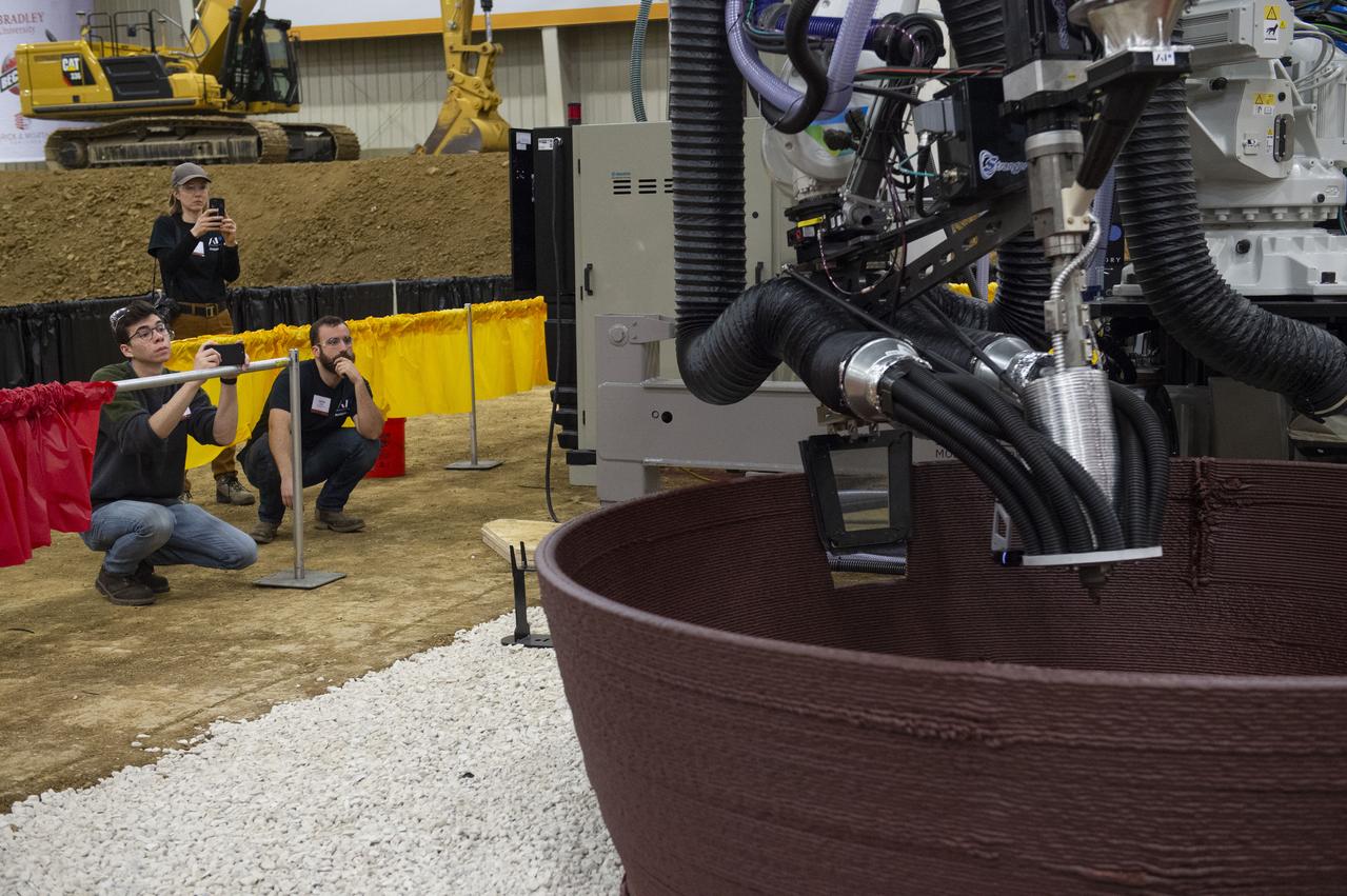 Team AI. SpaceFactory's printer autonomously inserts a window into their 3D-printed subscale habitat structure at NASA's 3D-Printed Habitat Challenge, held at the Caterpillar Edwards Demonstration & Learning Center in Edwards, Illinois, May 1-4, 2019. The habitat print is the final level of the multi-phase competition, which began in in 2015. The 3D-Printed Habitat Challenge is a competition to create sustainable shelters suitable for the Moon, Mars or beyond using resources available on-site in these locations. The challenge is managed by NASA's Centennial Challenges program, and partner Bradley University of Peoria, Illinois.