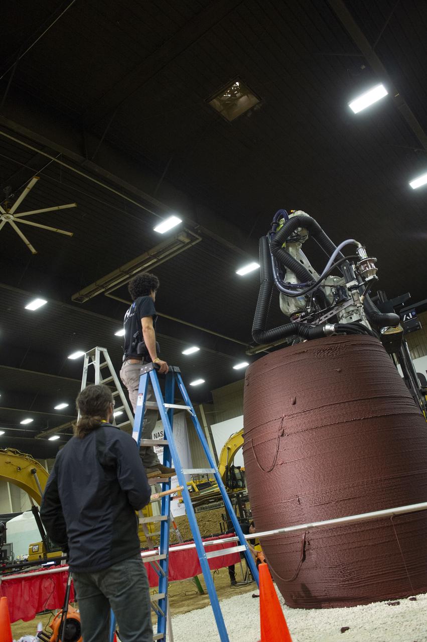 Two teams - Penn State (left) and AI. SpaceFactory (right) competed to 3D-print subscale habitat structures at NASA's 3D-Printed Habitat Challenge, held at the Caterpillar Edwards Demonstration & Learning Center in Edwards, Illinois, May 1-4, 2019. The habitat print is the final level of the multi-phase competition, which began in in 2015. The 3D-Printed Habitat Challenge is a competition to create sustainable shelters suitable for the Moon, Mars or beyond using resources available on-site in these locations. The challenge is managed by NASA's Centennial Challenges program, and partner Bradley University of Peoria, Illinois.