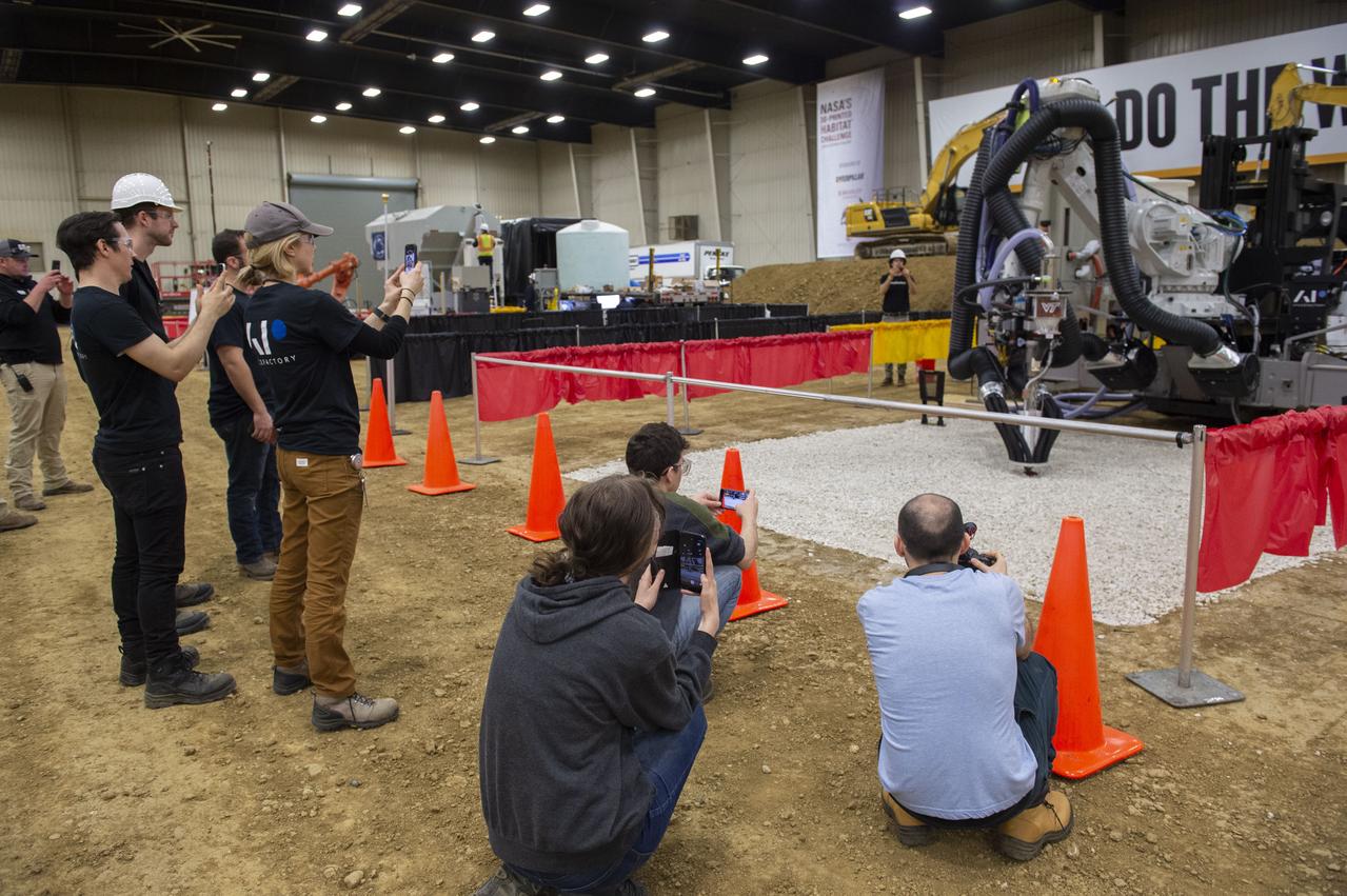 Team Penn State prepares their 3D-printer to begin printing a subscale habitat structure at NASA's 3D-Printed Habitat Challenge, held at the Caterpillar Edwards Demonstration & Learning Center in Edwards, Illinois, May 1-4, 2019. The habitat print is the final level of the multi-phase competition, which began in in 2015. The 3D-Printed Habitat Challenge is a competition to create sustainable shelters suitable for the Moon, Mars or beyond using resources available on-site in these locations. The challenge is managed by NASA's Centennial Challenges program, and partner Bradley University of Peoria, Illinois.
