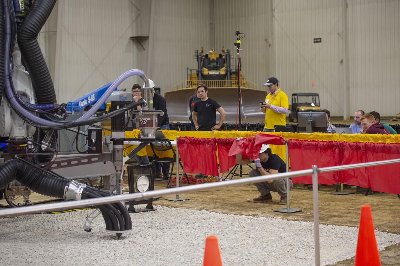 Team Penn State prepares their 3D-printer to begin printing a subscale habitat structure at NASA's 3D-Printed Habitat Challenge, held at the Caterpillar Edwards Demonstration & Learning Center in Edwards, Illinois, May 1-4, 2019. The habitat print is the final level of the multi-phase competition, which began in in 2015. The 3D-Printed Habitat Challenge is a competition to create sustainable shelters suitable for the Moon, Mars or beyond using resources available on-site in these locations. The challenge is managed by NASA's Centennial Challenges program, and partner Bradley University of Peoria, Illinois.