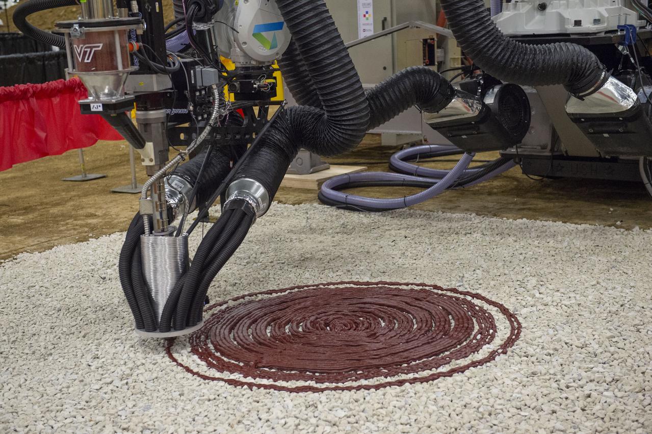 AI. SpaceFactory of New York and Pennsylvania State Team Penn State prepares their 3D-printer to begin printing a subscale habitat structure at NASA's 3D-Printed Habitat Challenge, held at the Caterpillar Edwards Demonstration & Learning Center in Edwards, Illinois, May 1-4, 2019. The habitat print is the final level of the multi-phase competition, which began in in 2015. The 3D-Printed Habitat Challenge is a competition to create sustainable shelters suitable for the Moon, Mars or beyond using resources available on-site in these locations. The challenge is managed by NASA's Centennial Challenges program, and partner Bradley University of Peoria, Illinois. 