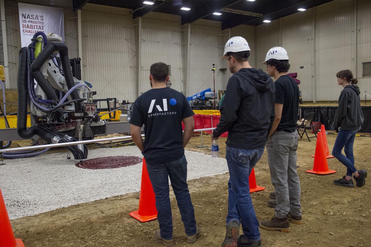Team Penn State prepares their 3D-printer to begin printing a subscale habitat structure at NASA's 3D-Printed Habitat Challenge, held at the Caterpillar Edwards Demonstration & Learning Center in Edwards, Illinois, May 1-4, 2019. The habitat print is the final level of the multi-phase competition, which began in in 2015. The 3D-Printed Habitat Challenge is a competition to create sustainable shelters suitable for the Moon, Mars or beyond using resources available on-site in these locations. The challenge is managed by NASA's Centennial Challenges program, and partner Bradley University of Peoria, Illinois.