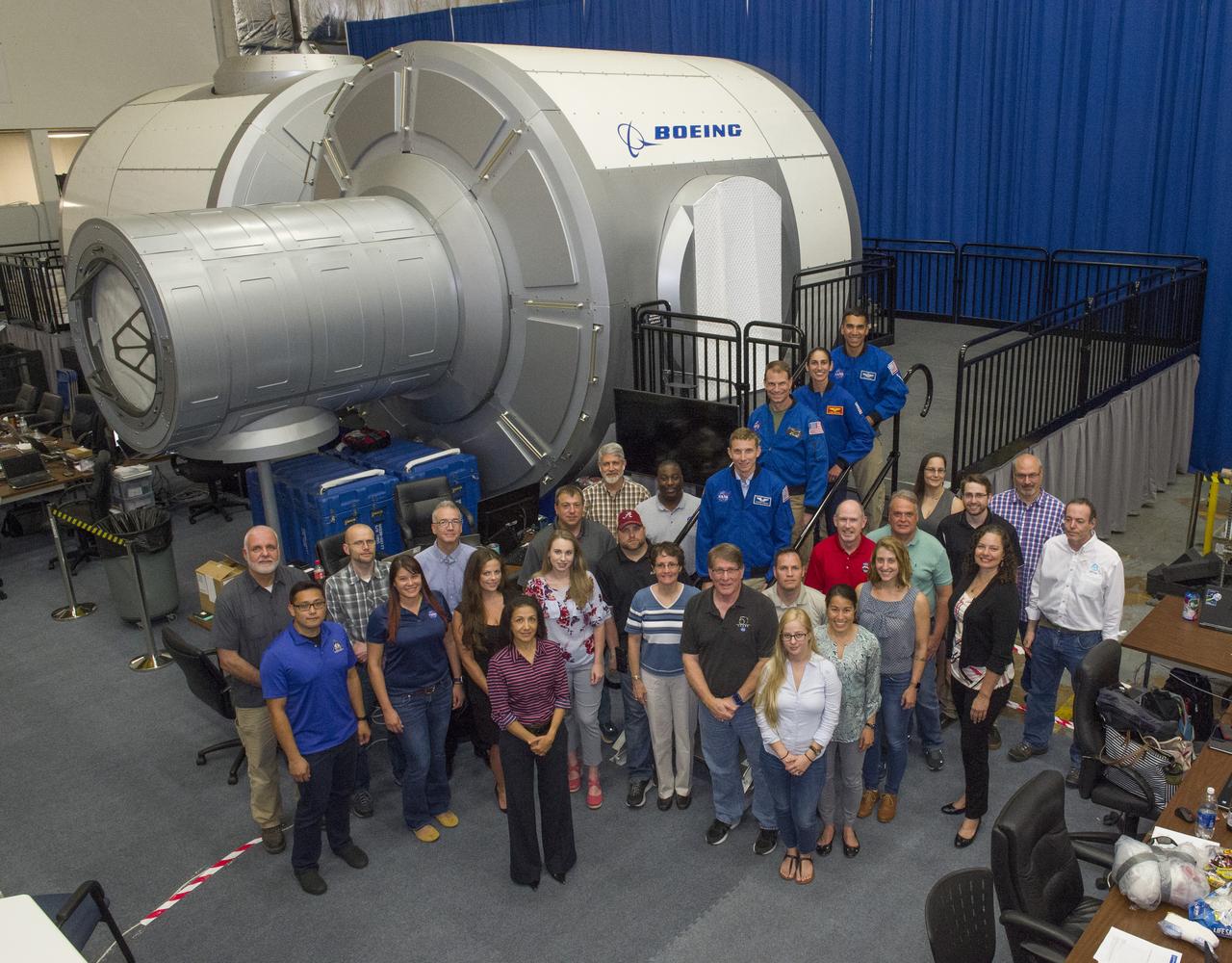 The Boeing Exploration Habitat Demonstrator at Marshall is one of five uniquely designed, deep space habitat prototypes in development through NASA’s Next Space Technologies for Exploration Partnerships, or NextSTEP. NASA and Boeing engineers and trainers pose with four astronauts training on the demonstrator.