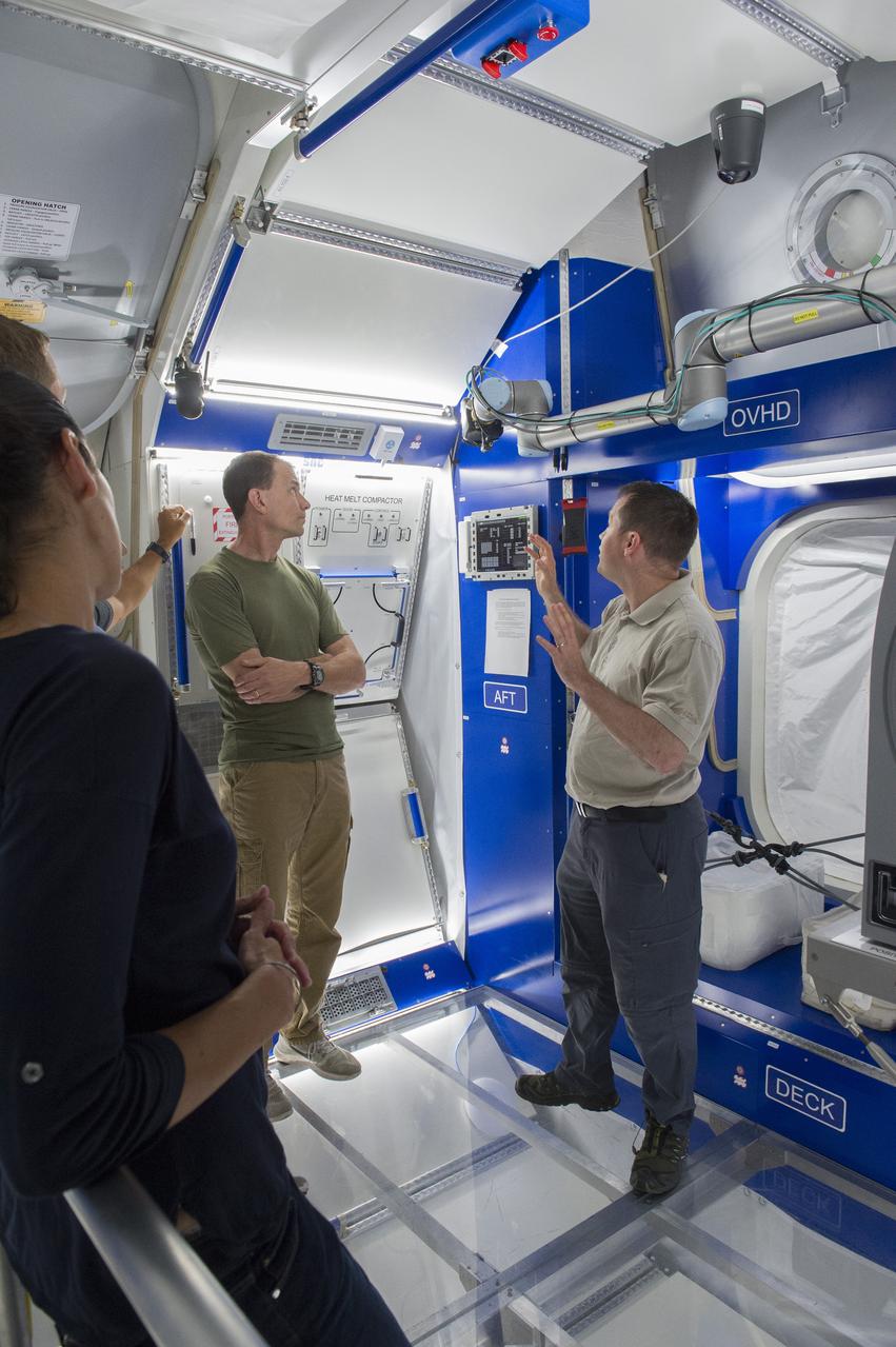 Boeing trainers conduct simulations inside the Boeing Exploration Habitat Demonstrator with astronauts to evaluate the internal layout and ergonomics, to support efficient work-life balance aboard a deep space ship.