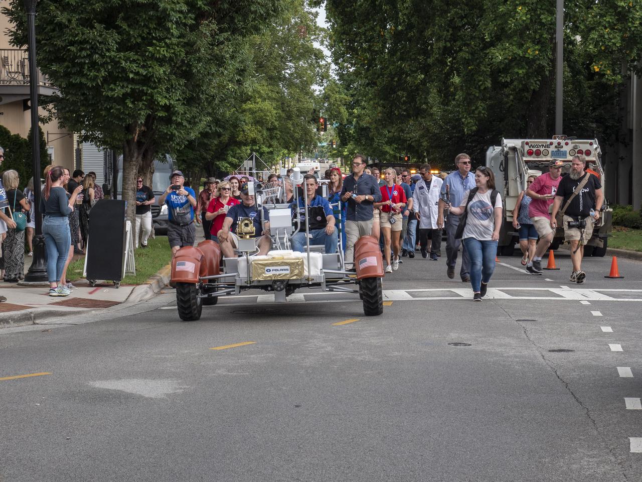 The City of Huntsville hosted a celebration of the Apollo 11 Moon landing with a street party on the downtown square with exhibits from the Marshall Space Flight Center and contributing contractors. The event was kicked off with remarks from Huntsville Mayor Tommy Battle, Marshall Space Flight Center's Director Jody Singer, and U.S. Space and Rocket Center's Director Deborah Barnhart with the Polaris replica of the Lunar Moon Buggy in the foreground. The Polaris Lunar Rover replica leads the parade into the Huntsville Square