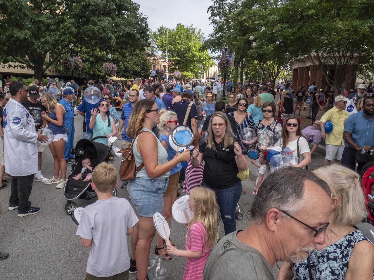 The City of Huntsville hosted a celebration of the Apollo 11 Moon landing with a street party on the downtown square with exhibits from the Marshall Space Flight Center and contributing contractors. The event was kicked off with remarks from Huntsville Mayor Tommy Battle, Marshall Space Flight Center's Director Jody Singer, and U.S. Space and Rocket Center's Director Deborah Barnhart with the Polaris replica of the Lunar Moon Buggy in the foreground.