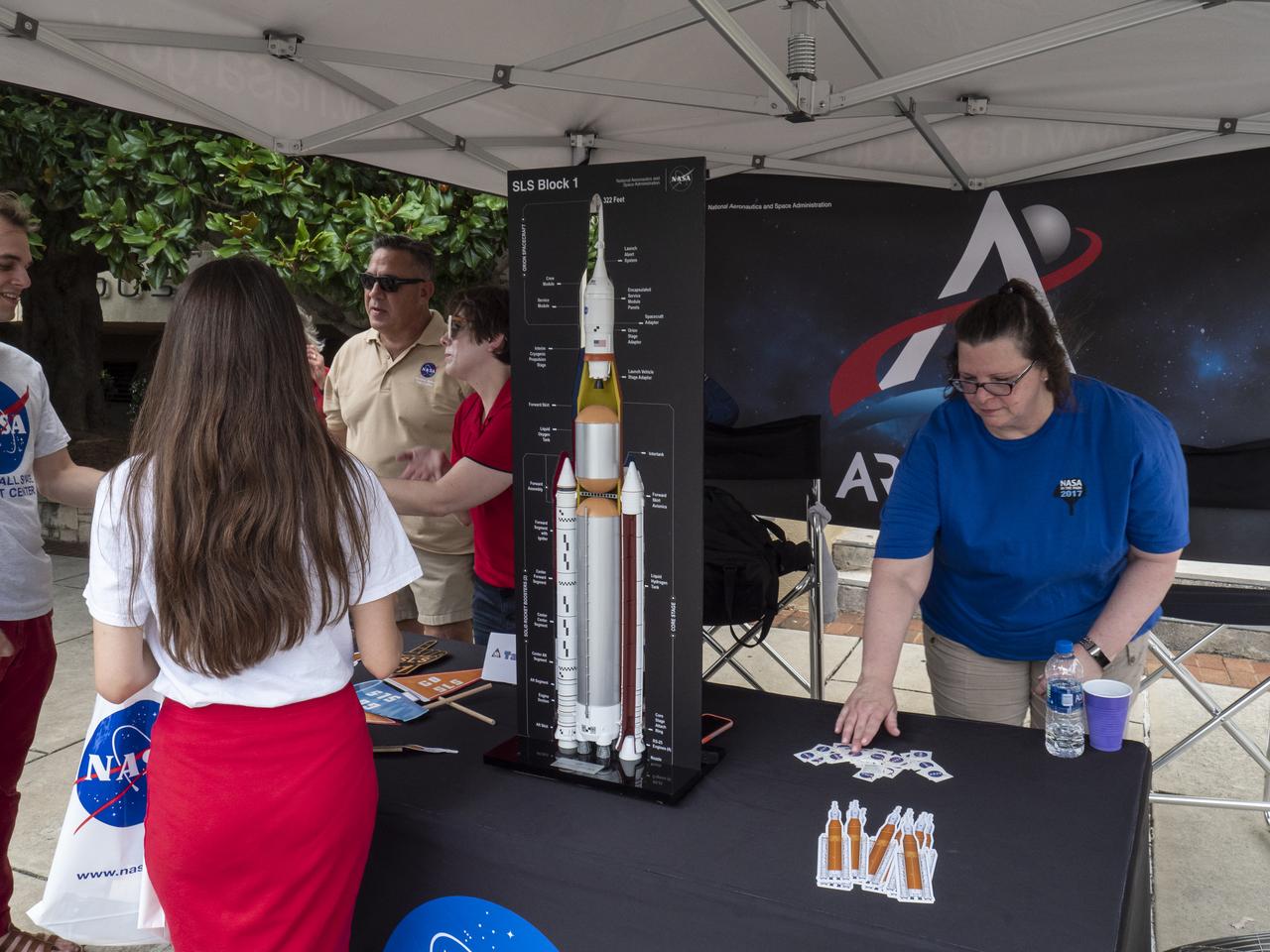 The City of Huntsville hosted a celebration of the Apollo 11 Moon landing with a street party on the downtown square with exhibits from the Marshall Space Flight Center and contributing contractors. The event was kicked off with remarks from Huntsville Mayor Tommy Battle, Marshall Space Flight Center's Director Jody Singer, and U.S. Space and Rocket Center's Director Deborah Barnhart with the Polaris replica of the Lunar Moon Buggy in the foreground.