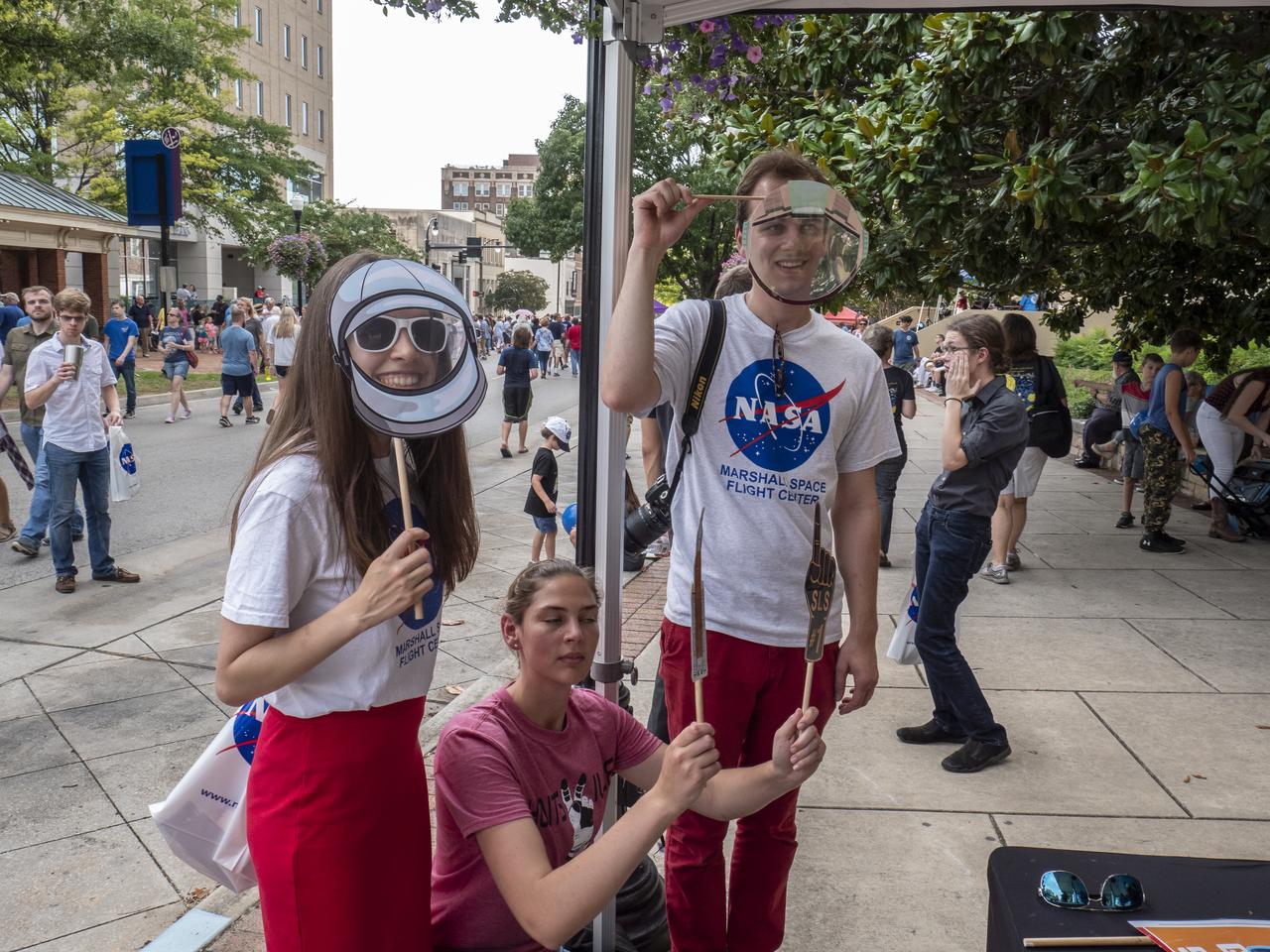 The City of Huntsville hosted a celebration of the Apollo 11 Moon landing with a street party on the downtown square with exhibits from the Marshall Space Flight Center and contributing contractors. The event was kicked off with remarks from Huntsville Mayor Tommy Battle, Marshall Space Flight Center's Director Jody Singer, and U.S. Space and Rocket Center's Director Deborah Barnhart with the Polaris replica of the Lunar Moon Buggy in the foreground.