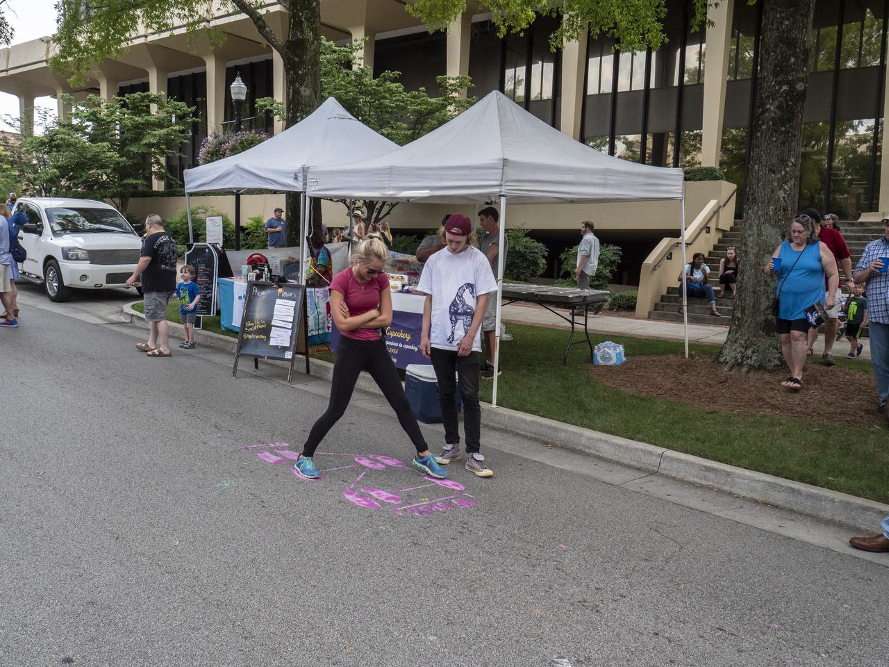 The City of Huntsville hosted a celebration of the Apollo 11 Moon landing with a street party on the downtown square with exhibits from the Marshall Space Flight Center and contributing contractors. The event was kicked off with remarks from Huntsville Mayor Tommy Battle, Marshall Space Flight Center's Director Jody Singer, and U.S. Space and Rocket Center's Director Deborah Barnhart with the Polaris replica of the Lunar Moon Buggy in the foreground.