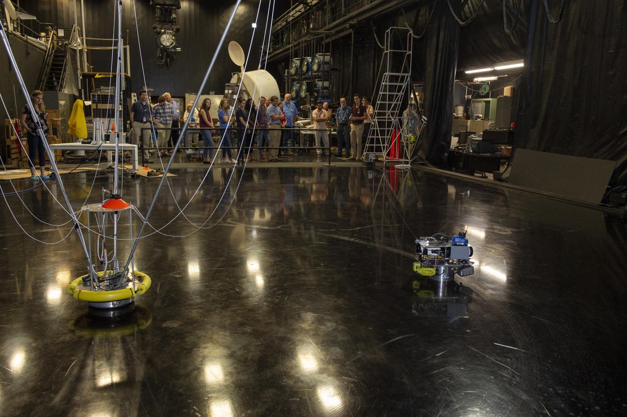  PATHWAYS INTERN ALEXANDRA BOEHM, AND JACOBS INTERN, PEYTON NELSON DEMONSTRATE STEERABLE AIR BEARING TETHER DEPLOYMENT SYSTEM TO MSFC SENIOR MANAGEMENT. ALSO WORKING ON THE PROJECT BUT NOT PICTURED WERE SUMMER INTERN ALI BERTELSMAN, PATHWAYS INTERN ANNA SHIPMAN, AND JACOBS FULL-TIME EMPLOYEE BRANDON MOORE.