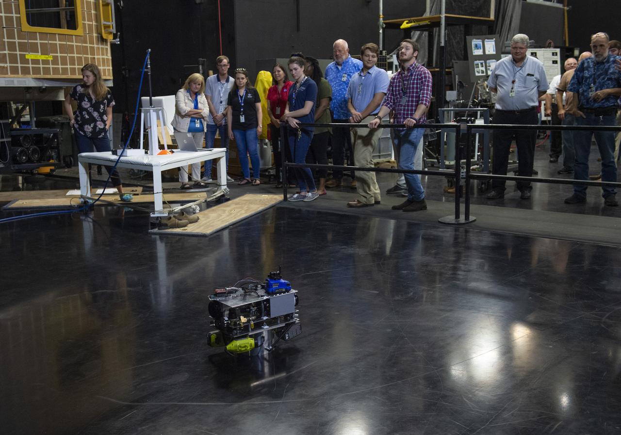  PATHWAYS INTERN ALEXANDRA BOEHM, AND JACOBS INTERN, PEYTON NELSON DEMONSTRATE STEERABLE AIR BEARING TETHER DEPLOYMENT SYSTEM TO MSFC SENIOR MANAGEMENT. ALSO WORKING ON THE PROJECT BUT NOT PICTURED WERE SUMMER INTERN ALI BERTELSMAN, PATHWAYS INTERN ANNA SHIPMAN, AND JACOBS FULL-TIME EMPLOYEE BRANDON MOORE.