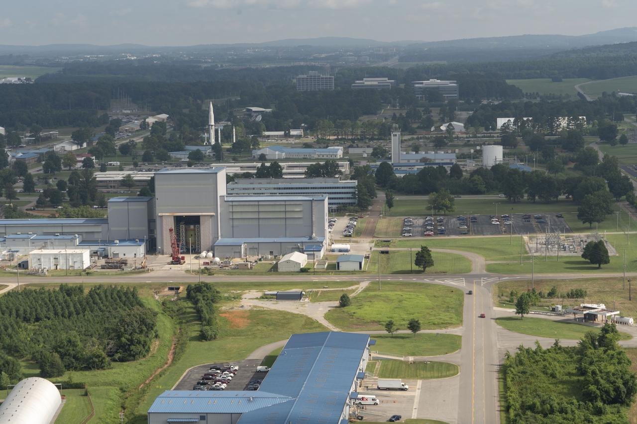 Aerial photograph of MSFC building 4719 with the SLS Intertank visible in the open doors