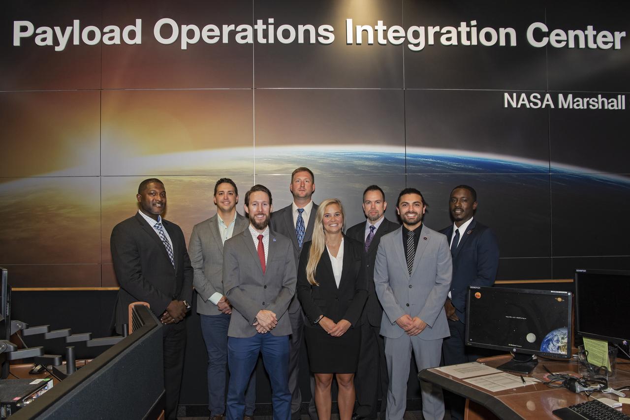 Official group photo of the new class of PODs (Payload Operations Directors) for 2019, taken in building 4663 Payload Operations Center. (L to R) Stacey Steele, Michael Vigo, Dr. Ian Howley, Luke Bingaman, Jennifer McMillian, Luke Mays, Carlos Barreto, David Nicholas Benjamin