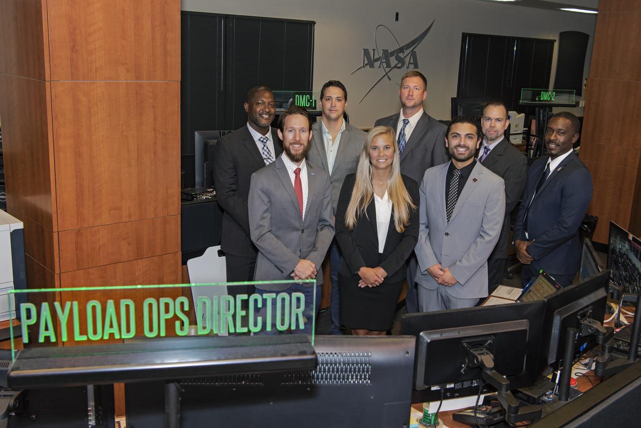 Official group photo of the new class of PODs (Payload Operations Directors) for 2019, taken in building 4663 Payload Operations Center. (L to R) Stacey Steele, Dr. Ian Howley, Michael Vigo, Jennifer McMillian, Luke Bingaman, Carlos Barreto, Luke Mays, David Nicholas Benjamin