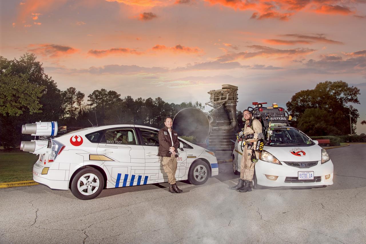 Andrew Denio, a Marshall information technology specialist in the Office of the Chief Information Officer, and Judson Hudson, a lab technician and computer-aided designer in Marshall’s Valve & Component Laboratory, show off their Ghostbusters and Star Wars themed vehicles in front of MSFC building 4200, for Halloween 2019. 