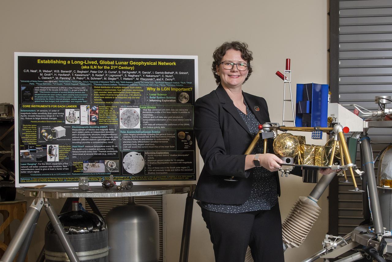 Environmental portrait of Renee Weber, commemorating her recent transition to the MSFC Chief Scientist position. Pictured with lunar lander models in the lander lab building 4747.