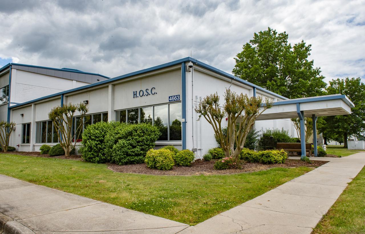 MSFC Building 4663, NW corner view showing entrance to Huntsville Operations Support Center (HOSC). The HOSC is home to the Payload Operations Integration Center (POIC) which supports the mission and scientific experiments aboard the International Space Station (ISS).