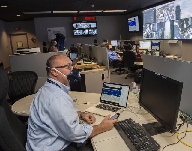 Steve Gaddis and teamsat NASA’s Marshall Space Flight Center help monitor launch conditions for the Demo-2 mission from the Huntsville Operations Support Center, HOSC.