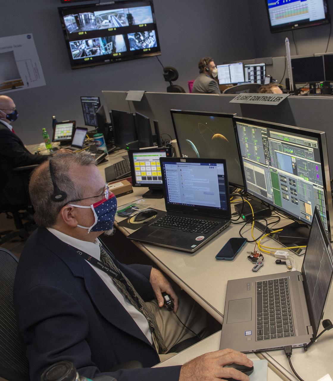 Ken Schrock, Paul Crawford, Adam Butt, and teams at NASA’s Marshall Space Flight Center help monitor launch conditions for the Demo-2 mission from the Huntsville Operations Support Center, HOSC.