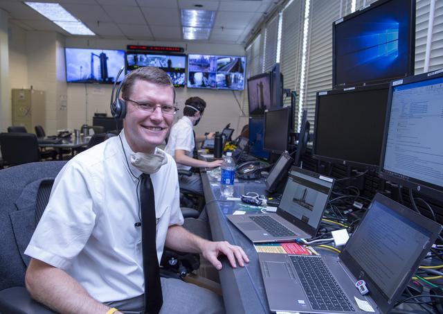 NASA image:  Adam Butt and Teams at NASA’s Marshall Space Flight Center help monitor launch conditions for the Demo-2 mission from the Huntsville Operations Support Center, HOSC.