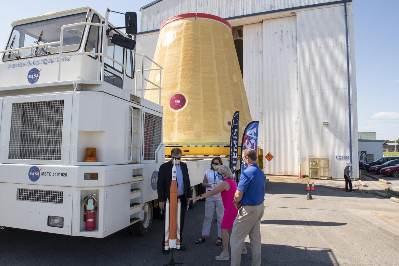 Jody Singer, director of NASA’s Marshall Space Flight Center in Huntsville, Alabama, joins local government officials and others as the Marshall move team prepares to transport the Artemis I launch vehicle stage adapter for the agency’s Space Launch System (SLS) rocket. Huntsville-based Teledyne Brown Engineering built the launch vehicle stage adapter at a state-of-the-art manufacturing facility at Marshall. Teledyne officials joined Singer to see the adapter one last time before it heads to the barge. This is the last piece of Marshall-built SLS rocket hardware set for delivery to Kennedy in preparation of the Artemis I mission to the Moon. A move team led by Marshall’s Center Operations will transport the adapter from the manufacturing facility to NASA’s Pegasus barge. The barge will take the adapter to NASA’s Kennedy Space Center in Florida for assembly and launch. Other parts of the Artemis I SLS rocket that were manufactured in Alabama include the Orion stage adapter built by Marshall teams and the Interim Cryogenic Propulsion Stage, which was built by Boeing and United Launch Alliance in Decatur, Alabama and will provide the power to send Orion to the Moon.