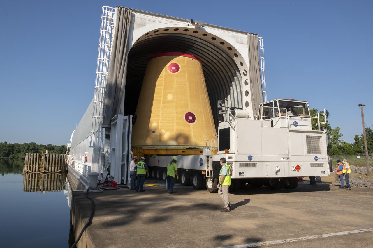 The move team loads the launch vehicle stage adapter, part of the agency’s new Space Launch System (SLS) rocket, on NASA’s Pegasus barge at NASA’s Marshall Space Flight Center in Huntsville, Alabama, July 17. The launch vehicle stage adapter, which connects the rocket’s 212-foot-tall core stage to the rocket’s upper stage, is being shipped to NASA’s Kennedy Space Center in Florida for Artemis I launch preparations. This is the final piece of Artemis I SLS rocket hardware built at Marshall to be delivered to Kennedy. Only the SLS core stage, currently in final testing at Stennis Space Center near Bay St. Louis, Mississippi, remains to be shipped to Kennedy on Pegasus. NASA is working to land the first woman and the next man on the Moon by 2024. SLS, along with Orion, the human landing system, and the Gateway in orbit around the Moon are NASA’s backbone for a new generation of deep space exploration.  