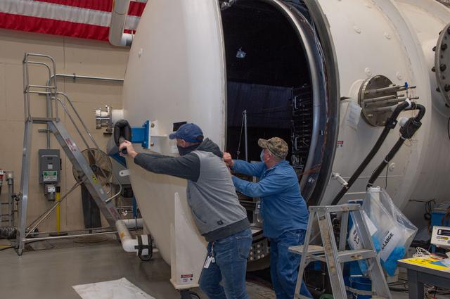 NASA image:  Opening Thermal Vacuum Chamber V15 to extract hot box containing NEA Scout spacecraft.