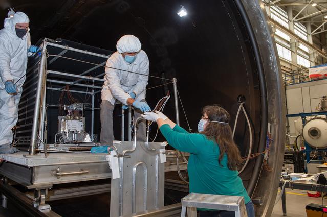 NASA image: Miria Finckenor collects Optical Witness Samples and swab sample