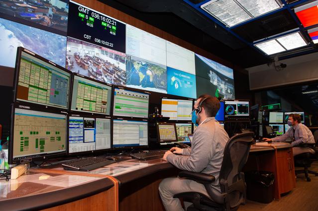 NASA image: A look inside the International Space Station Payload Operations Integration Center at NASA’s Marshall Space Flight Center in Huntsville, AL.  The POIC team supports science operations on the International Space Station 24 hours a day, 7 days a week. For more than 20 years the POIC team has worked with scientists from around the world to enable the space station crew to conduct experiments that improve life on Earth and enable future exploration.