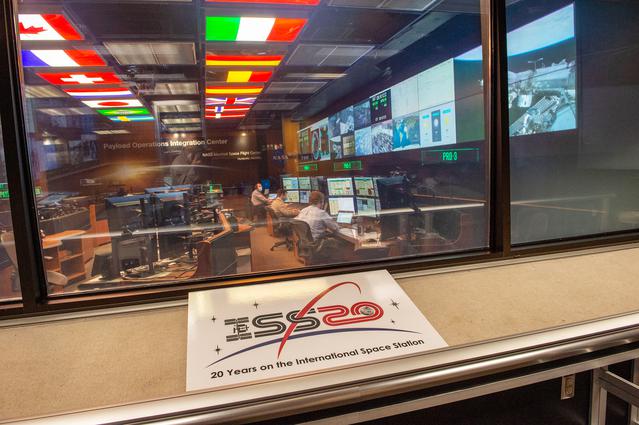 NASA image: A look inside the International Space Station Payload Operations Integration Center at NASA’s Marshall Space Flight Center in Huntsville, AL.  The POIC team supports science operations on the International Space Station 24 hours a day, 7 days a week. For more than 20 years the POIC team has worked with scientists from around the world to enable the space station crew to conduct experiments that improve life on Earth and enable future exploration.