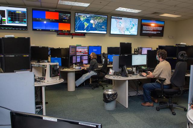 NASA image: A look inside the International Space Station Payload Operations Integration Center at NASA’s Marshall Space Flight Center in Huntsville, AL.  The POIC team supports science operations on the International Space Station 24 hours a day, 7 days a week. For more than 20 years the POIC team has worked with scientists from around the world to enable the space station crew to conduct experiments that improve life on Earth and enable future exploration.