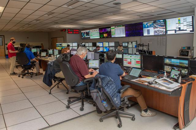 NASA image: A look inside the International Space Station Payload Operations Integration Center at NASA’s Marshall Space Flight Center in Huntsville, AL.  The POIC team supports science operations on the International Space Station 24 hours a day, 7 days a week. For more than 20 years the POIC team has worked with scientists from around the world to enable the space station crew to conduct experiments that improve life on Earth and enable future exploration.