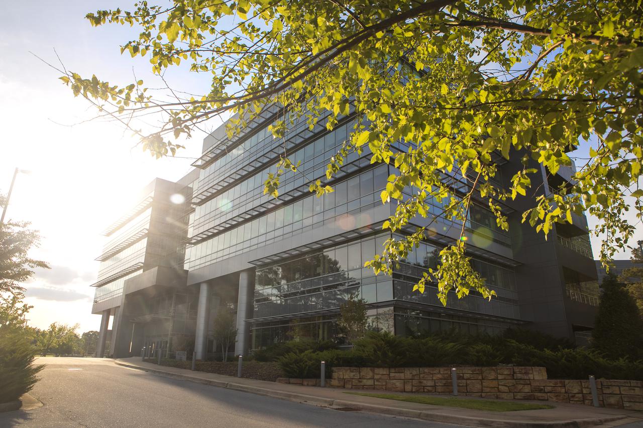 The southward-facing side of Building 4220 on Marshall Space Flight Center’s campus is illuminated by the afternoon sun.