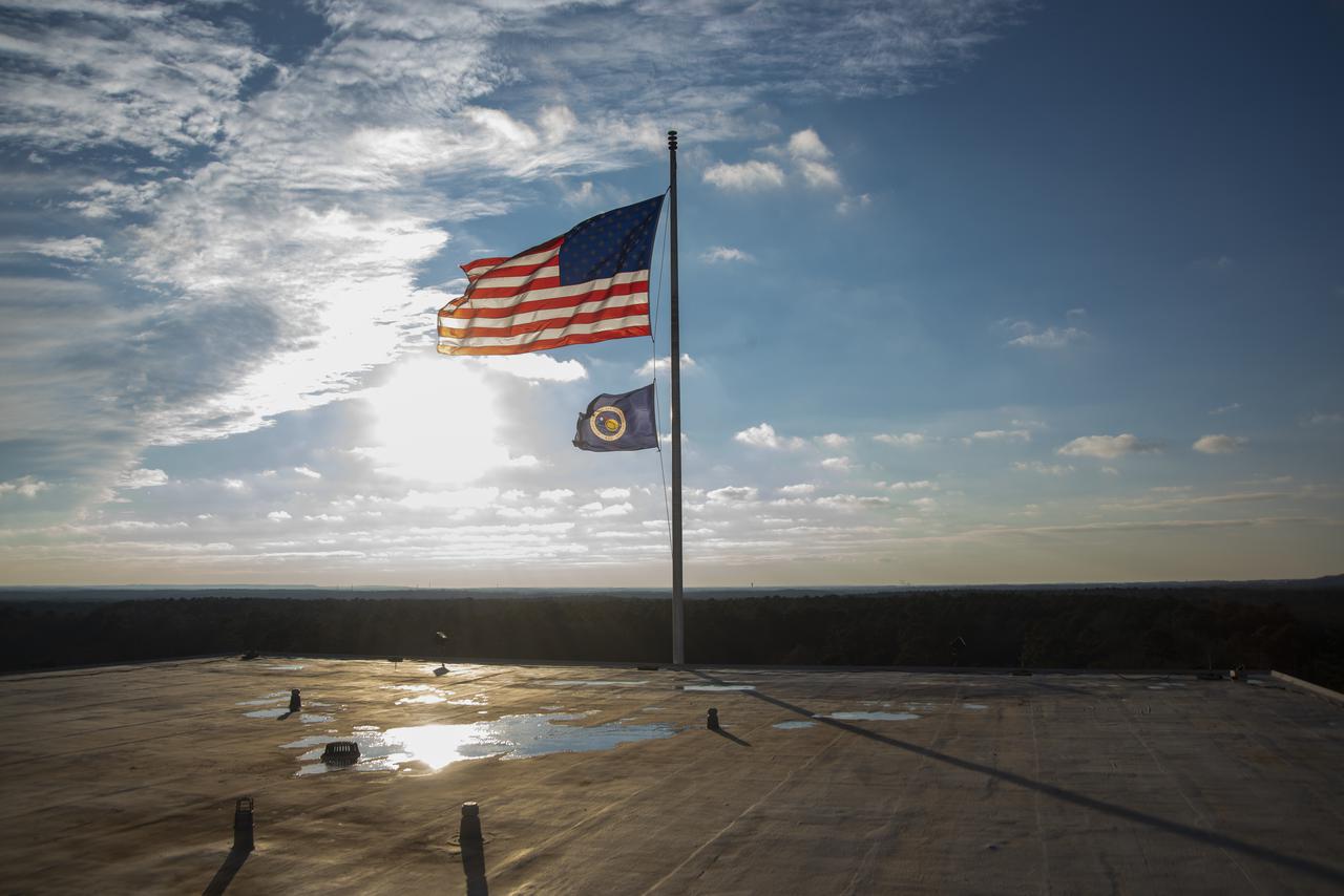 The U.S. and NASA flags atop Building 4200 at NASA Marshall Space Flight Center in Huntsville, Alabama, were retired Jan. 21, 2022. These images show center operations employees lowering the flags at Building 4200, which was Marshall’s original central laboratory and office building and served as Marshall’s headquarters since 1963. This building will be demolished later this year. A flag-raising ceremony marking the transfer of Marshall headquarters to Building 4221 was held Jan. 26, 2022. The doors to Building 4221 opened on Earth Day, April 22, 2019.