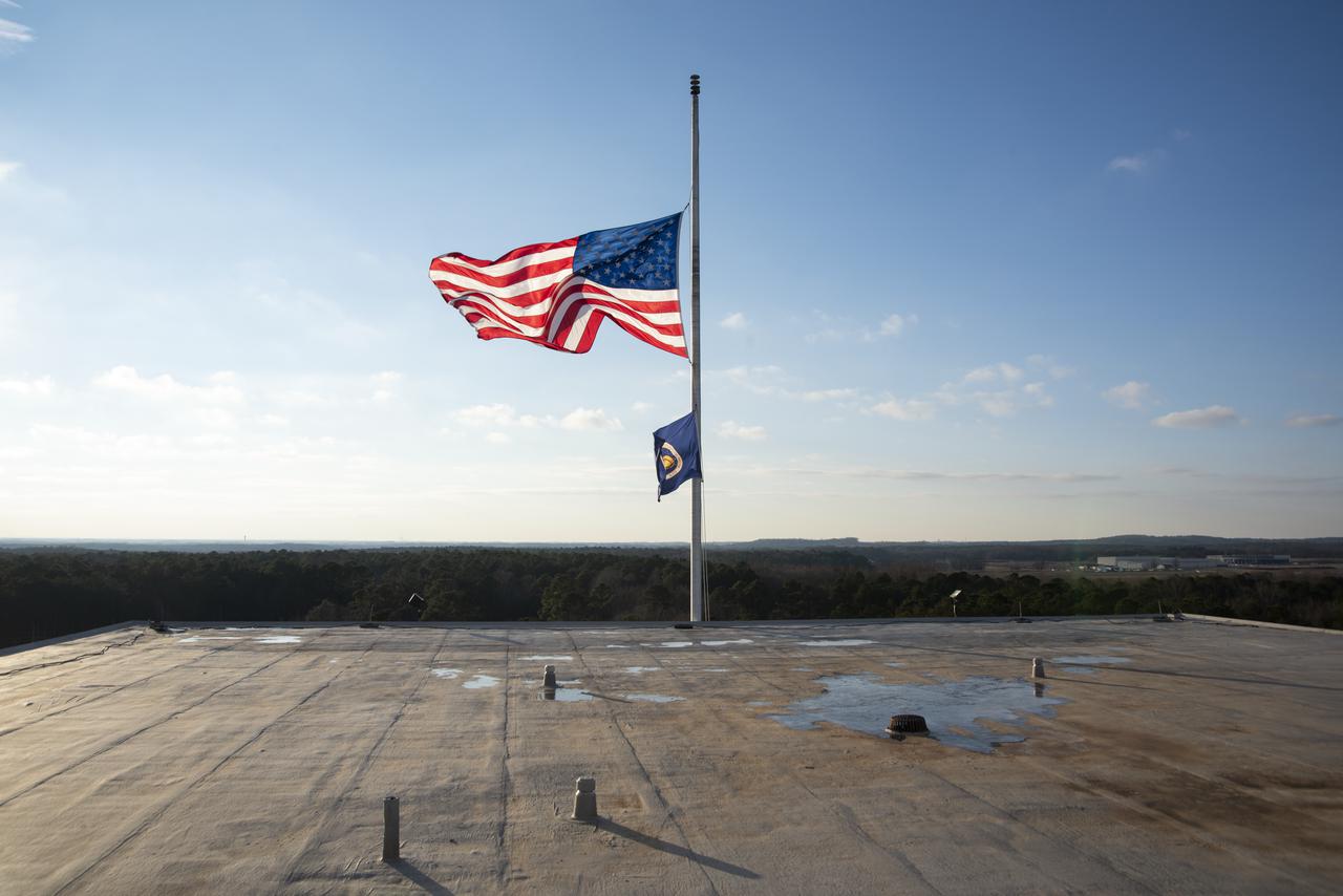 The U.S. and NASA flags atop Building 4200 at NASA Marshall Space Flight Center in Huntsville, Alabama, were retired Jan. 21, 2022. These images show center operations employees lowering the flags at Building 4200, which was Marshall’s original central laboratory and office building and served as Marshall’s headquarters since 1963. This building will be demolished later this year. A flag-raising ceremony marking the transfer of Marshall headquarters to Building 4221 was held Jan. 26, 2022. The doors to Building 4221 opened on Earth Day, April 22, 2019.