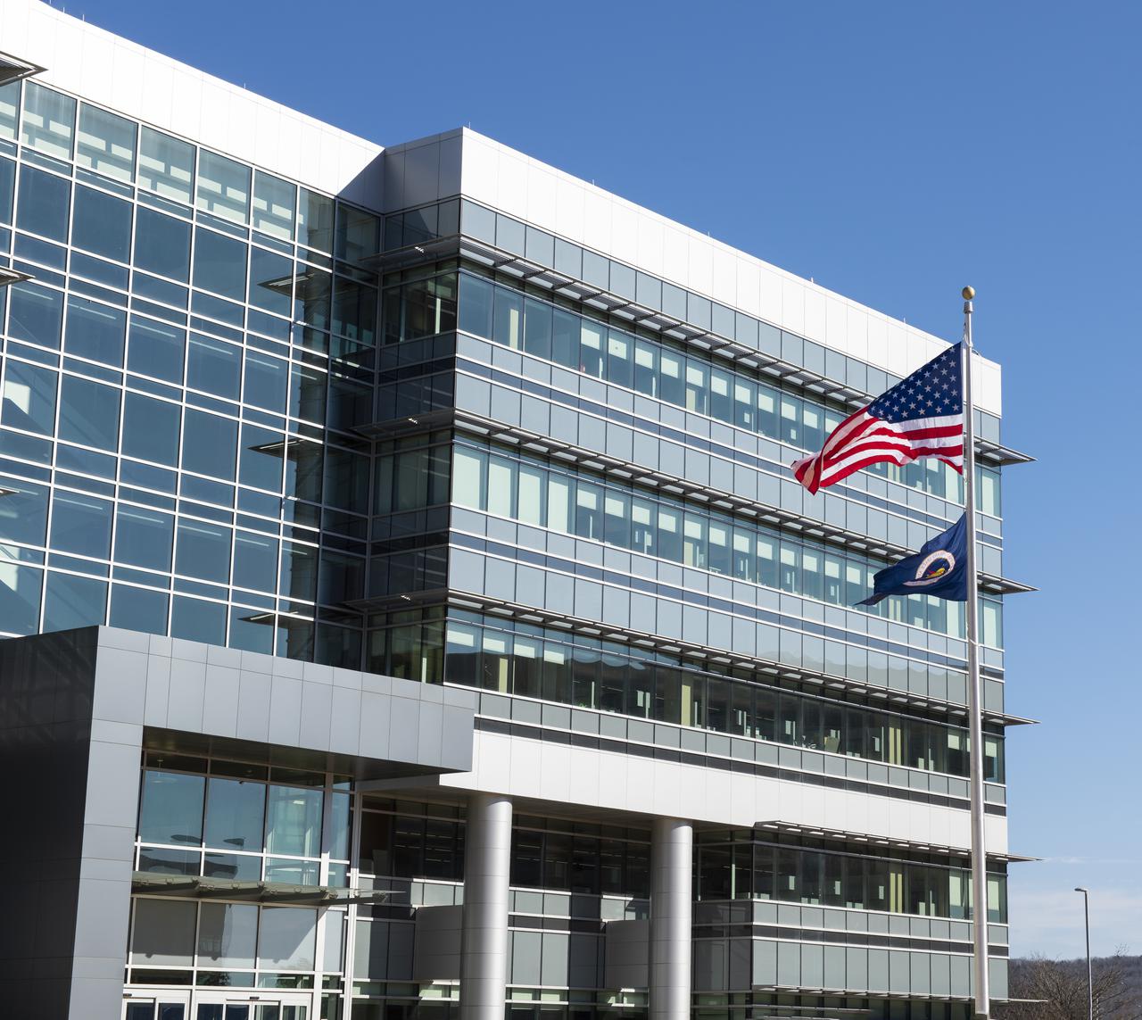 On Jan. 26, 2022, the U.S. and NASA flags were raised at Building 4221 to mark the transfer of headquarters to that building at Marshall Space Flight Center in Huntsville, Alabama. The doors to Building 4221, a new, environmentally friendly building, opened on Earth Day, April 22, 2019. Building 4200 served as Marshall’s original headquarters  since 1963. Marshall center operations lowered flags at that building on Jan. 21, 2022.