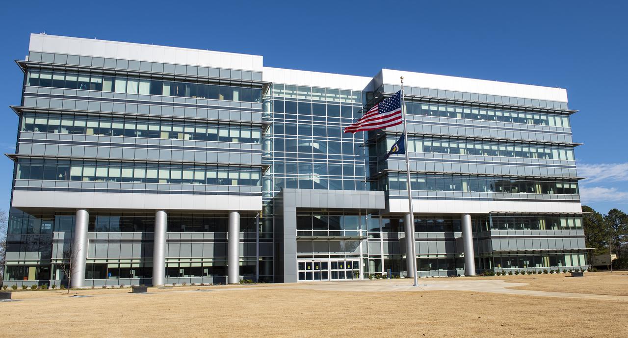 On Jan. 26, 2022, the U.S. and NASA flags were raised at Building 4221 to mark the transfer of headquarters to that building at Marshall Space Flight Center in Huntsville, Alabama. The doors to Building 4221, a new, environmentally friendly building, opened on Earth Day, April 22, 2019. Building 4200 served as Marshall’s original headquarters  since 1963. Marshall center operations lowered flags at that building on Jan. 21, 2022.