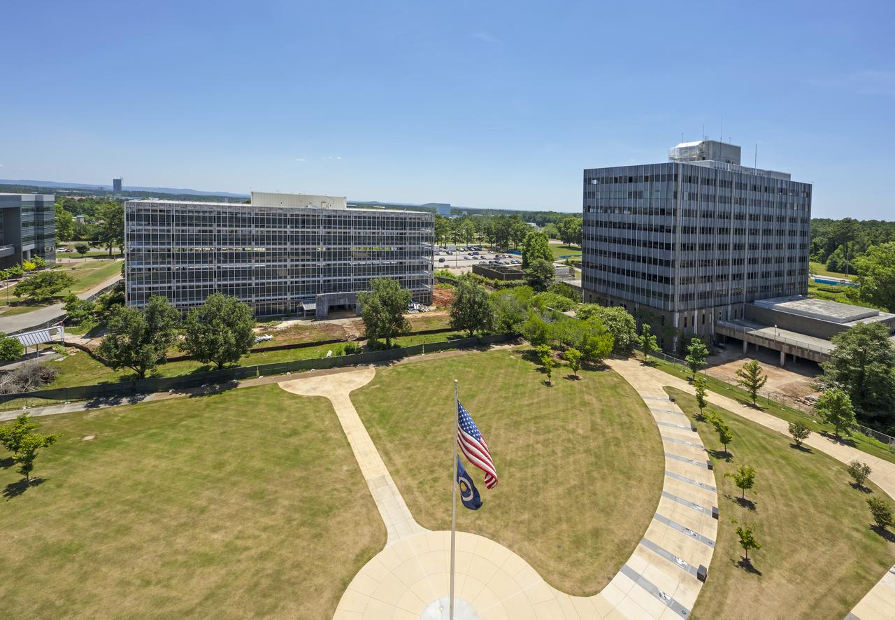 Buildings 4201 (left) and 4200 (right) of Marshall’s administrative complex are seen in September 2022 as they were being prepared for demolition. Building 4200 was Marshall’s administrative headquarters from 1963 until 2020. The projects will make way for a series of newer, more energy-efficient facilities, providing worksites for new generations of engineers, scientists, and support teams.