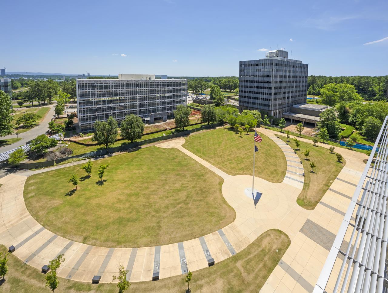 Buildings 4201 (left) and 4200 (right) of Marshall’s administrative complex are seen in September 2022 as they were being prepared for demolition. Building 4200 was Marshall’s administrative headquarters from 1963 until 2020. The projects will make way for a series of newer, more energy-efficient facilities, providing worksites for new generations of engineers, scientists, and support teams.